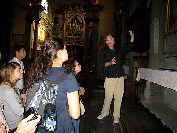 Mac Manus explaining a painting in the Basilica di San Marco, Florence.